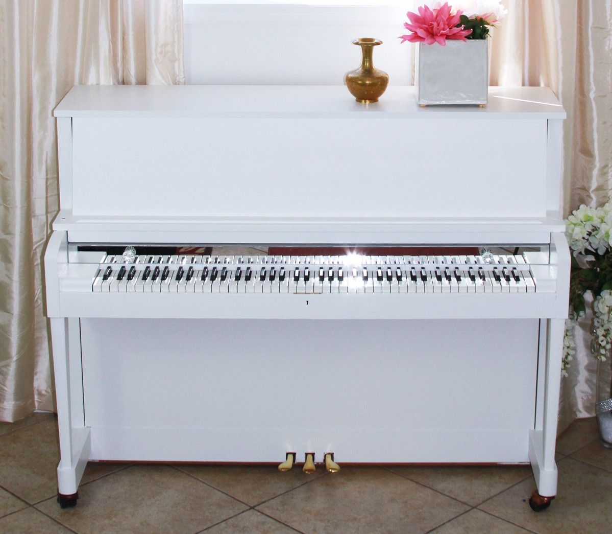 Lydia’s white upright piano in her Green Lane home studio